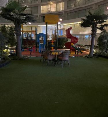 Dumas Apartment | Cozy Rajhans Belliza Service Apartment with Pool & Restaurant