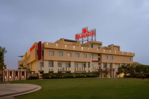 Village Hokra Hotel | Experience Ramada Ajmer: Poolside Retreat with Ocean Views