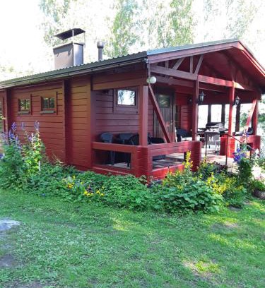 Pihtipudas Villa | Rantapuro: Oceanfront Retreat with Private Beach & Hot Tub