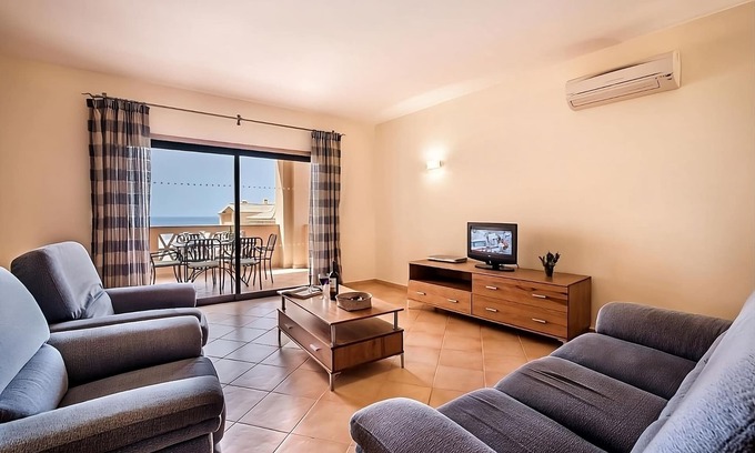 Praia da Luz Hotel | Discover a Cozy 2BR Retreat with Pools and Ocean Views