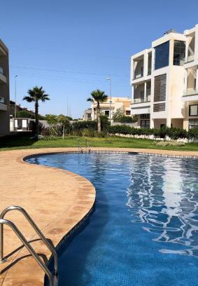 Oujda Apartment | Discover Rawan Residency: Family-Friendly with Pool & Dining