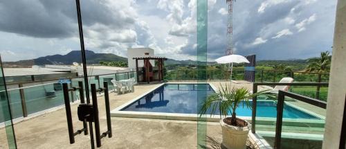 Capitolio House | Elegant Recanto Brenda: Scenic Lake Views and Pool Access