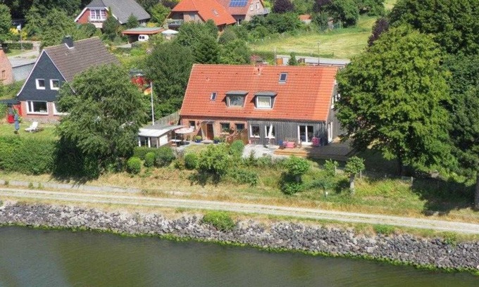 Sehestedt House | Beautiful RED Holiday Home with Oceanfront Views