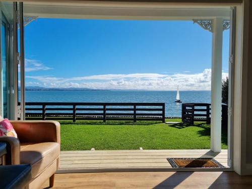Clarks Beach House | Beachfront Comfort at Red Rock Cottage - 4-Star Retreat