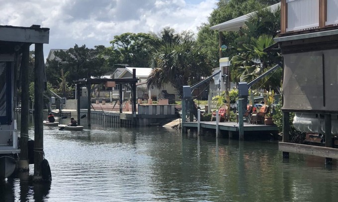 Indian Harbor Estates House | Reel Paradise Cottage: Ideal Canal Front with Dock Access