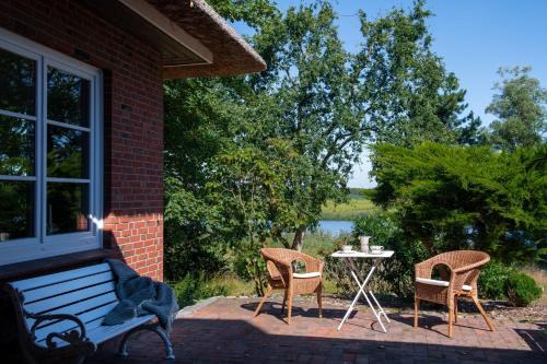 Breiholz House | Charming Oceanfront Stay at Reetdachhaus Eiderblick