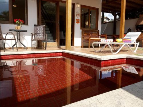 Jabaquara House | Rubi Hotel: Modern Suites with Ocean View & Pool Access