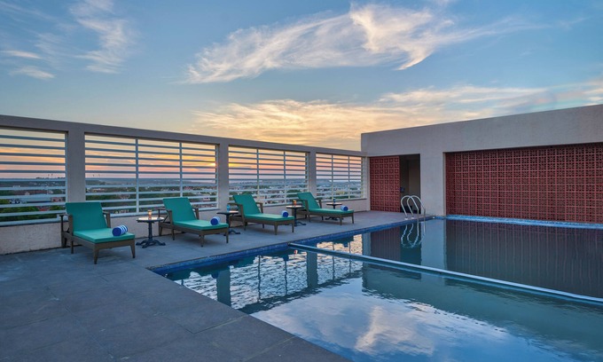 Gwalior Hotel | Regenta Place Gwalior: Family-Friendly Retreat with Pool