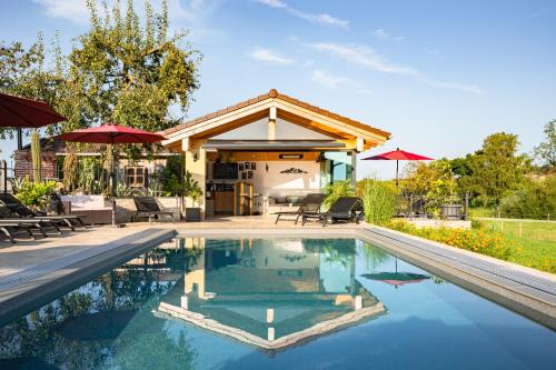 Brunning Apartment | Reiherhof: 5-Star Oceanfront Retreat with Spa & Pool
