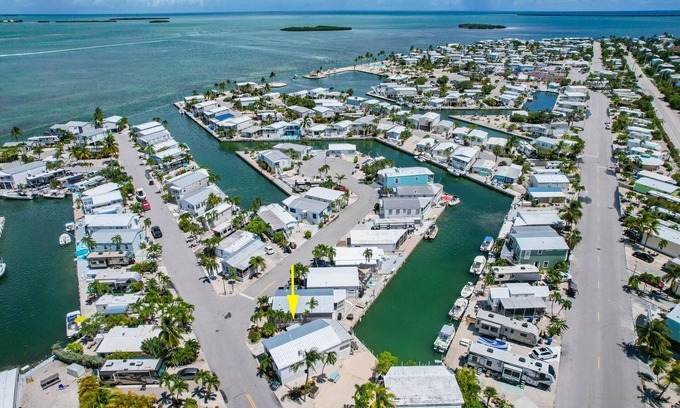 Cudjoe Key House | Canal Front Retreat: Pet Friendly with Pool & Ocean Views