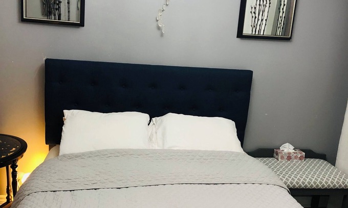 Saint Thomas House | Relax in our cozy room with a private bath, designed for comfort and privacy.