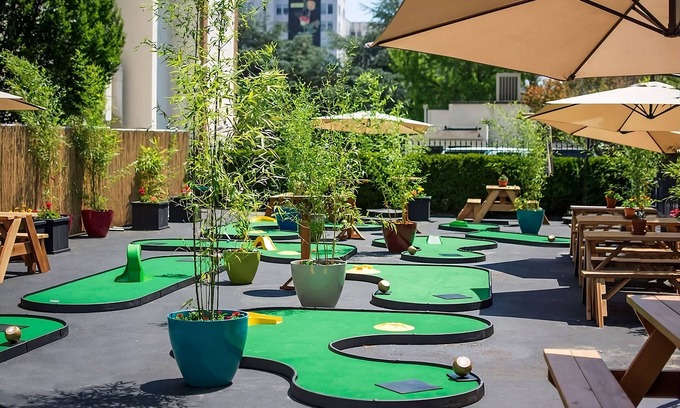 Goose Hollow Hotel | Relax in Style! Pet-Friendly Units with Mini-Golf & Cinema
