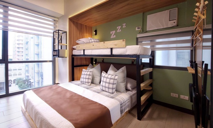Bonifacio Global City Condo | Relaxing Family Condo with Games, Movies, and a Pool