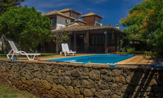 Marina House | Tranquil Escape: Poolside Relaxation in Nature's Embrace