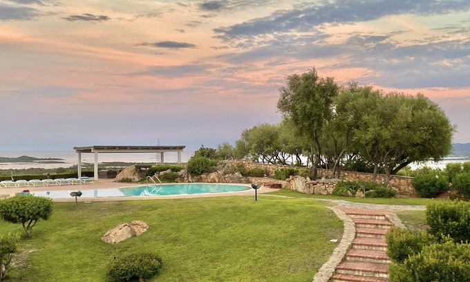 San Teodoro Apartment | Oceanfront Apartment with Pool & Stunning Sea Views