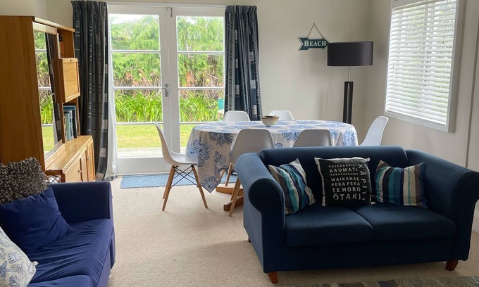 Waikanae House | Inviting Olde Beach Holiday Bach with Oceanfront Views