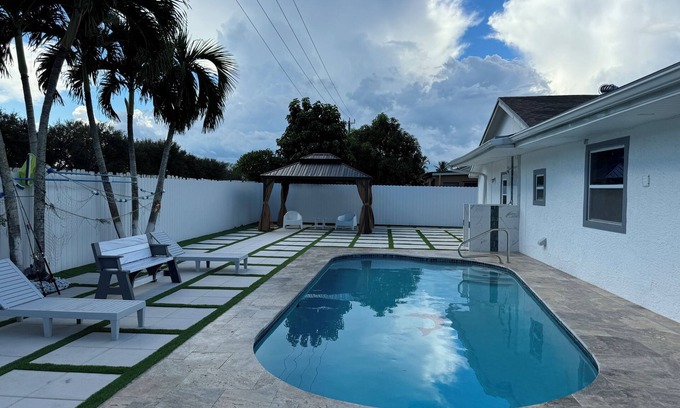Royal Palm Beach House | Cozy Family Retreat with Heated Pool, Near Airport & Ocean