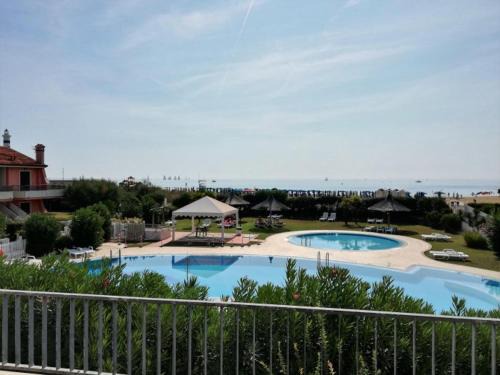 San Briccio Apartment | Experience Residence Porto Sole with Oceanfront Relaxation