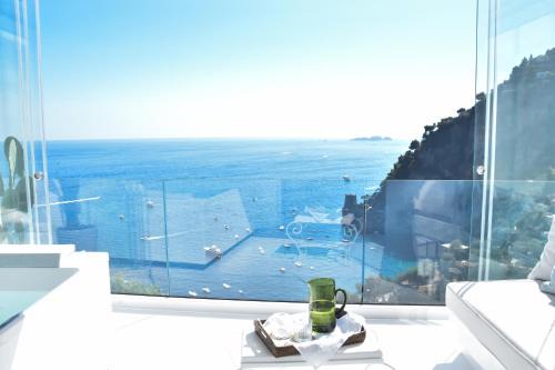 Positano Apartment | Discover Comfort at Residenza La Zerina with Pool Access