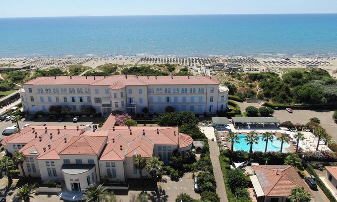 Calambrone Apartment | Relaxing Retreat: Principi di Piemonte Apartment with Pool