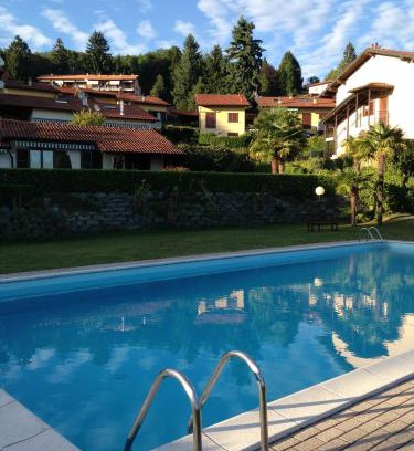 Colmegna Apartment | Cozy Residenza Paradiso with Pool & Child-Friendly Fun