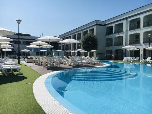 Lido di Spina Apartment | Cozy Beachside Apartment with Pool and Kitchen Amenities