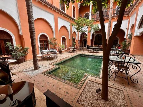Sidi Ben Slimane El Jazouli House | Discover Riad Amina: 4-Star Oasis with Pool & Ocean View