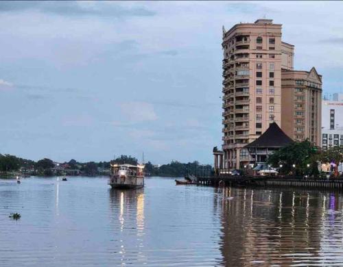 Kampung Surabaya Apartment | Tranquil Riverbank Suite at Waterfront KCH - 4-Star Retreat