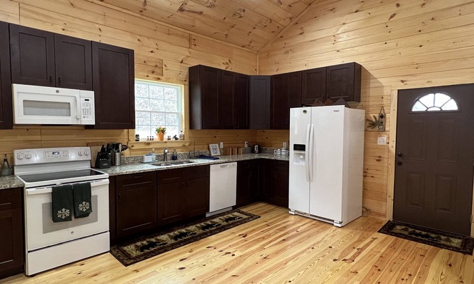 Newland Cabin | Exquisite Riverfront Log Cabin with Fire Pit & Deck