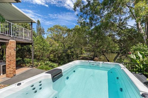 Elanora House | Relaxing Riverfront Oasis with Hot Tub in Elanora