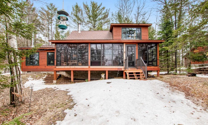 Lac du Flambeau Cabin | Riverfront Retreat with Dock, Kitchen & Firepit - Rated 10/10