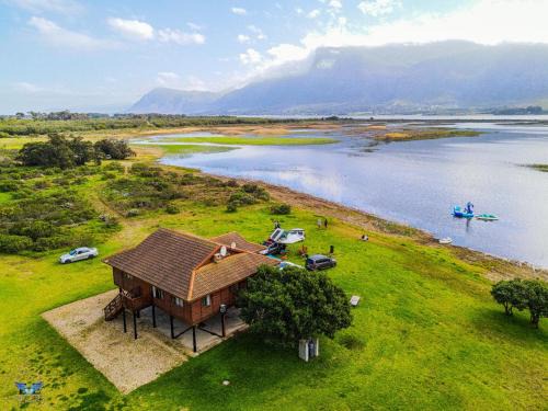 Overstrand House | Eco-Friendly Rivers End Farm with Ocean Views & Hot Tub