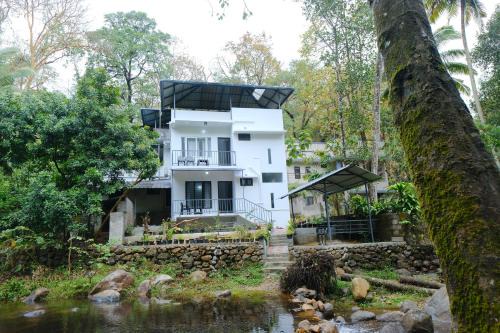 Ponmundi House | Riverside Bliss Villa