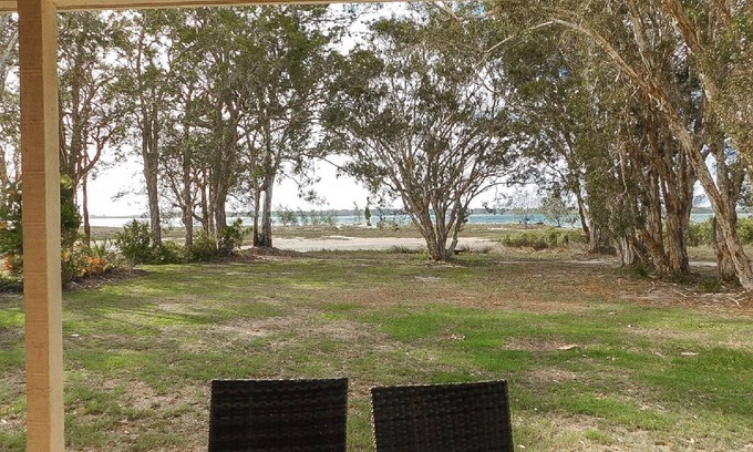 Burrum Heads Villa | Riverside Retreat: Riverfront 3BR with Ocean Views