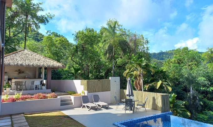 Mahe Island Apartment | Idyllic Riverside Retreat in Seychelles with Spa & Pool