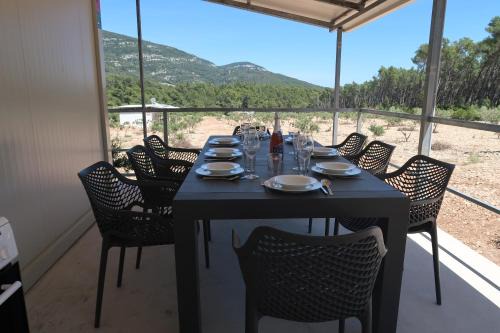 Cara House | Relax at Robinson Olive Tree Huts - Pet and Child Friendly