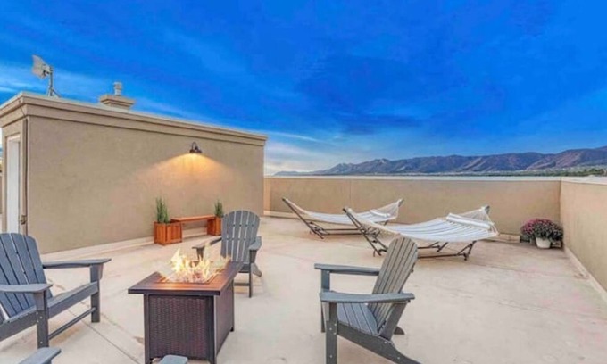 Monument House | Inviting Hotel with Rooftop Patio and Hot Tub Near AFA