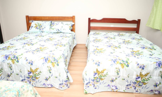 Piumhi House | Cozy Room 5 at Pousada Pérola Mineira for Family Getaways