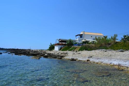 Ag. Georgios Apartment | Rousalis Studio: Oceanfront Retreat in Corfu, Greece