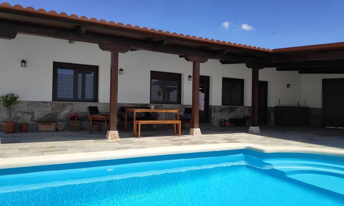 Pedro Munoz Ski Chalet | Tranquil Rural Retreat with Pool and Garden Oasis