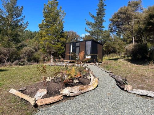 Golden Bay House | Cozy Ruru Tiny House: Family-Friendly Escape Awaits
