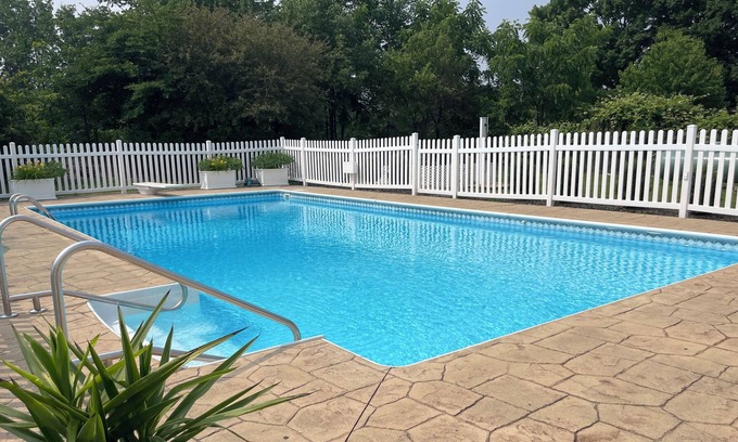 Thompson Ridge House | Indulge in Our Glamping Trailer Hideaway with Heated Pool