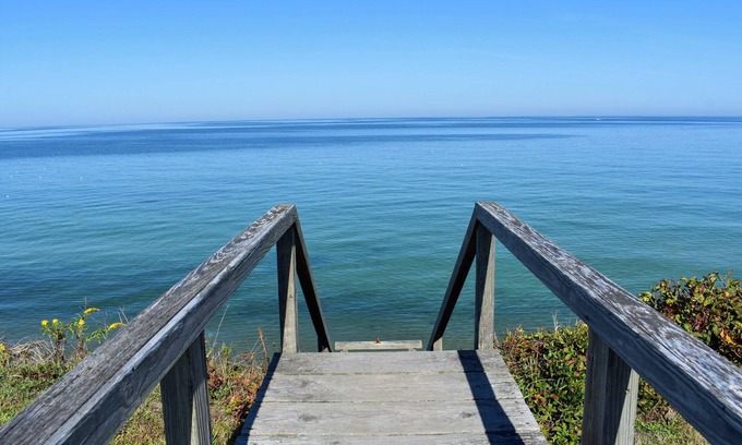 Dennis House | Rustic Oceanfront Retreat with Private Beach and Expansive Deck