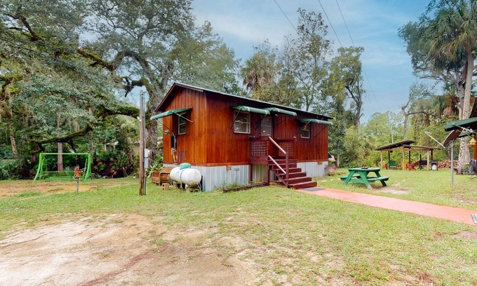 Bronson Cabin | Scenic Riverfront Cabin with Canoe & Cozy Firepit