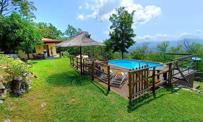 Licciana Nardi Villa | Scenic Farmhouse Retreat with Pool and Garden Oasis