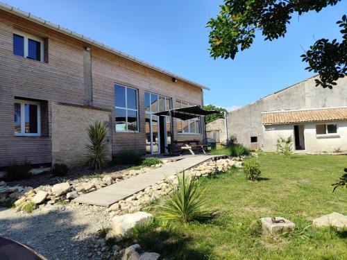 Marcillac House | Beachfront Retreat: Renovated Oceanview Grange Experience