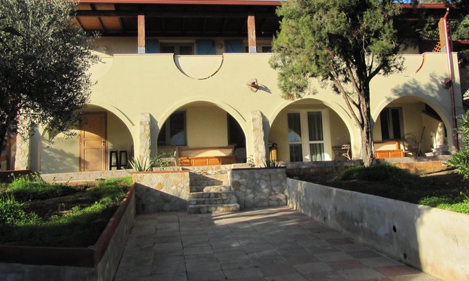 Sarroch House | Tranquil Apartment Steps from the Sea with Pool & Views