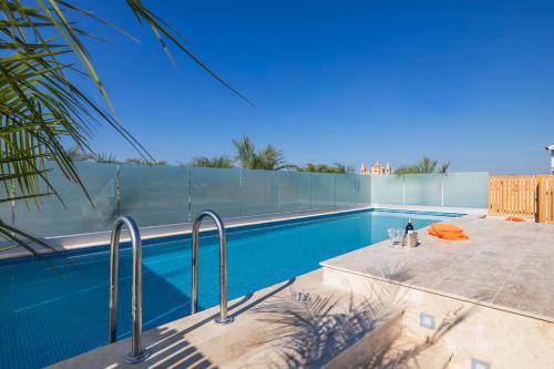 Ghaxaq Apartment | Oceanfront Salmar Court Holiday Apartments with Pool Access