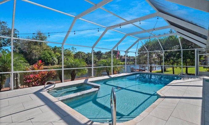 Palm Harbor House | Discover SALTY TURTLE: Poolside Retreat with Tiki Bar