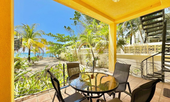 French Harbour House | Oceanfront Sand View Condo #5 at Coral Sands, West Bay Beach